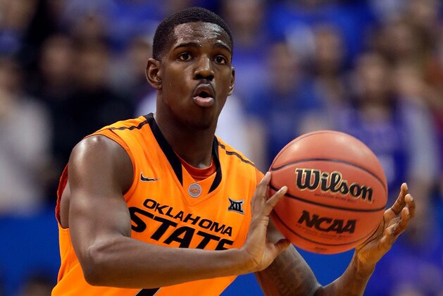 LAWRENCE, KS - JANUARY 14:  Jawun Evans #1 of the Oklahoma State Cowboys controls the ball during the game against the Kansas Jayhawks at Allen Fieldhouse on January 14, 2017 in Lawrence, Kansas.  (Photo by Jamie Squire/Getty Images)
