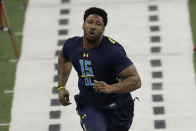 Texas A&M defensive end Myles Garrett runs the 40-yard dash at the NFL football scouting combine Sunday, March 5, 2017, in Indianapolis. (AP Photo/David J. Phillip)