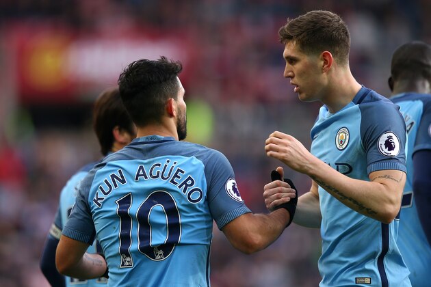 SUNDERLAND, ENGLAND - MARCH 05:  Sergio Aguero of Manchester City celebrates scoring the first goal to make the score 0-1 with his team-mate John Stones during the Premier League match between Sunderland and Manchester City at Stadium of Light on March 5, 2017 in Sunderland, England.  (Photo by Robbie Jay Barratt - AMA/Getty Images)
