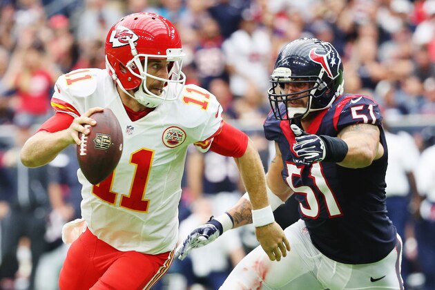 HOUSTON, TX - SEPTEMBER 18:  Alex Smith #11 of the Kansas City Chiefs runs away from the tackle of  John Simon #51 of the Houston Texans in the third quarter of their game at NRG Stadium on September 18, 2016 in Houston, Texas.  (Photo by Scott Halleran/Getty Images)