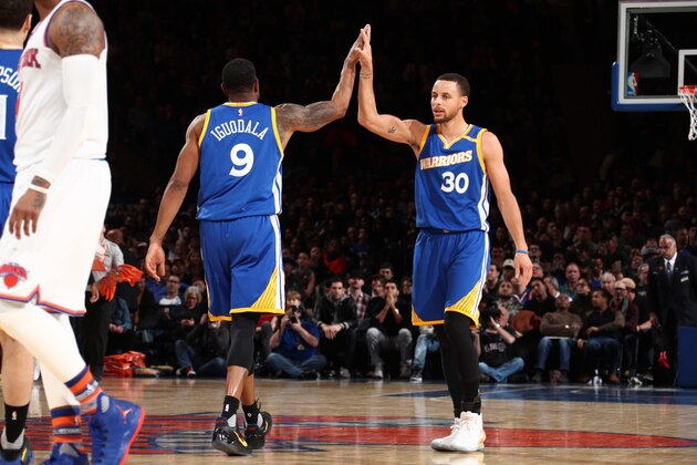 NEW YORK, NY - MARCH 5: Andre Iguodala #9 and Stephen Curry #30 of the Golden State Warriors high five against the New York Knicks on March 5, 2017 at Madison Square Garden in New York City, New York.  NOTE TO USER: User expressly acknowledges and agrees that, by downloading and or using this photograph, User is consenting to the terms and conditions of the Getty Images License Agreement. Mandatory Copyright Notice: Copyright 2017 NBAE  (Photo by Nathaniel S. Butler/NBAE via Getty Images)