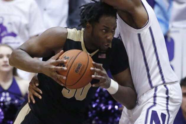 Purdue forward Caleb Swanigan, left, drives against Northwestern center Dererk Pardon during the second half of an NCAA college basketball game, Sunday, March 5, 2017, in Evanston, Ill. Purdue won 69-65. (AP Photo/Nam Y. Huh)