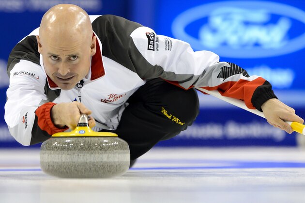 Canada's skip Kevin Koe delivers a stone durign the gold medal game Canada vs Denmark at the World Men's Curling Championships on April 10, 2016 in Basel. / AFP / FABRICE COFFRINI        (Photo credit should read FABRICE COFFRINI/AFP/Getty Images)