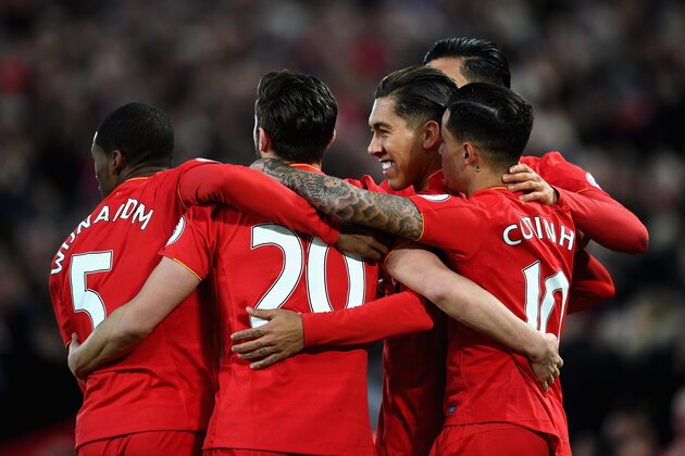LIVERPOOL, ENGLAND - MARCH 04: Roberto Firmino of Liverpool (R) celebrates scoring his sides first goal with his Liverpool team mates during the Premier League match between Liverpool and Arsenal at Anfield on March 4, 2017 in Liverpool, England.  (Photo by Laurence Griffiths/Getty Images)