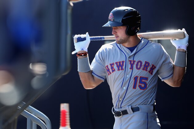 PEORIA, AZ - OCTOBER 13:  Tim Tebow #15 (New York Mets) of the Scottsdale Scorpions warms up in the dugout during the Arizona Fall League game against the Peoria Javelinas at Peoria Stadium on October 13, 2016 in Peoria, Arizona.  (Photo by Christian Petersen/Getty Images)