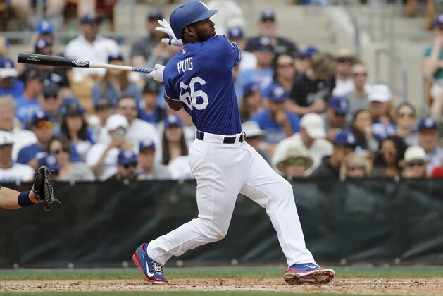 GLENDALE, AZ - MARCH 05: Yasiel Puig #66 of the Los Angeles Dodgers hits a fly ball in the sixth inning against the Seattle Mariners during the spring training game at Camelback Ranch on March 5, 2017 in Glendale, Arizona. (Photo by Tim Warner/Getty Images)