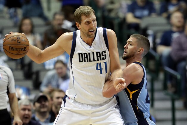 DALLAS, TX - MARCH 03:  Dirk Nowitzki #41 of the Dallas Mavericks dribbles the ball against Chandler Parsons #25 of the Memphis Grizzlies at American Airlines Center on March 3, 2017 in Dallas, Texas.  NOTE TO USER: User expressly acknowledges and agrees that, by downloading and/or using this photograph, user is consenting to the terms and conditions of the Getty Images License Agreement.  (Photo by Ronald Martinez/Getty Images)