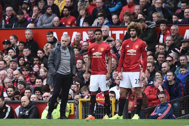 Manchester United's Portuguese manager Jose Mourinho (L) stands with substitutes, Manchester United's English striker Marcus Rashford and Manchester United's Belgian midfielder Marouane Fellaini (R) during the English Premier League football match between Manchester United and Bournemouth at Old Trafford in Manchester, north west England, on March 4, 2017. / AFP PHOTO / Oli SCARFF / RESTRICTED TO EDITORIAL USE. No use with unauthorized audio, video, data, fixture lists, club/league logos or 'live' services. Online in-match use limited to 75 images, no video emulation. No use in betting, games or single club/league/player publications.  /         (Photo credit should read OLI SCARFF/AFP/Getty Images)