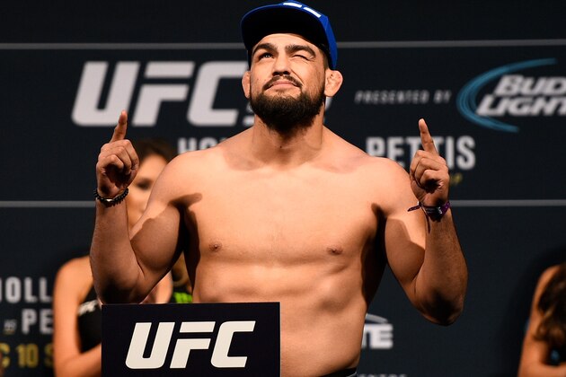 TORONTO, CANADA - DECEMBER 09:  Kelvin Gastelum poses on the scale during the UFC 206 weigh-in inside the Air Canada Centre on December 9, 2016 in Toronto, Ontario, Canada. (Photo by Jeff Bottari/Zuffa LLC/Zuffa LLC via Getty Images)