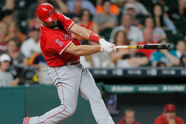 HOUSTON, TX - SEPTEMBER 24:  Albert Pujols #5 of the Los Angeles Angels of Anaheim singles in a run in the eighth inning against the Houston Astros at Minute Maid Park on September 24, 2016 in Houston, Texas.  (Photo by Bob Levey/Getty Images)