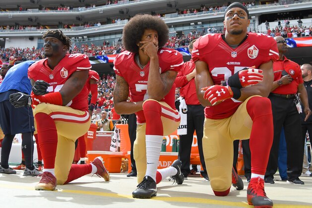 SANTA CLARA, CA - OCTOBER 02:  (L-R) Eli Harold #58, Colin Kaepernick #7 and Eric Reid #35 of the San Francisco 49ers kneel on the sideline during the National Anthem prior to the game against the Dallas Cowboys at Levi's Stadium on October 2, 2016 in Santa Clara, California.  (Photo by Thearon W. Henderson/Getty Images)