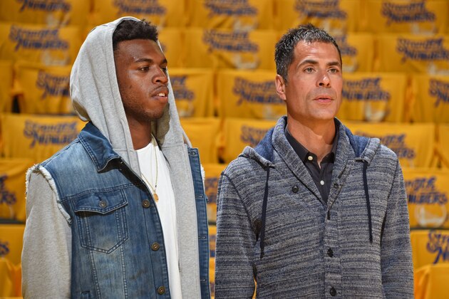 OAKLAND, CA - MAY 30: Basketball player Buddy Hield and agent Rob Pelinka watches the game between the Golden State Warriors and the Oklahoma City Thunder during Game Seven of the Western Conference Finals during the 2016 NBA Playoffs on May 30, 2016 at ORACLE Arena in Oakland, California. NOTE TO USER: User expressly acknowledges and agrees that, by downloading and or using this Photograph, user is consenting to the terms and conditions of the Getty Images License Agreement. Mandatory Copyright Notice: Copyright 2016 NBAE (Photo by Andrew Bernstein/NBAE via Getty Images)