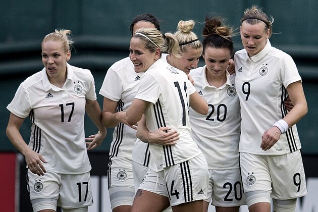 Germany's forward Anja Mittag (11) celebrates with teammates after scoring the first goal during their match against England in the She Believes Cup at RFK Stadium March 7, 2017 in Washington, DC. / AFP PHOTO / Brendan Smialowski        (Photo credit should read BRENDAN SMIALOWSKI/AFP/Getty Images)