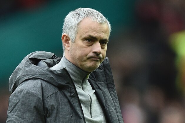 Manchester United's Portuguese manager Jose Mourinho is pictured on the pitch after the English Premier League football match between Manchester United and Bournemouth at Old Trafford in Manchester, north west England, on March 4, 2017.
The game finished 1-1. / AFP PHOTO / Oli SCARFF / RESTRICTED TO EDITORIAL USE. No use with unauthorized audio, video, data, fixture lists, club/league logos or 'live' services. Online in-match use limited to 75 images, no video emulation. No use in betting, games or single club/league/player publications.  /         (Photo credit should read OLI SCARFF/AFP/Getty Images)
