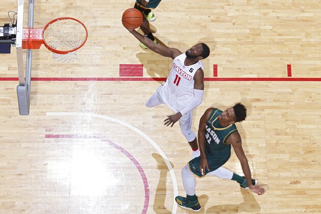 DAYTON, OH - FEBRUARY 21: Scoochie Smith #11 of the Dayton Flyers lays the ball in ahead of Jalen Jenkins #31 of the George Mason Patriots in the second half of the game at UD Arena on February 21, 2017 in Dayton, Ohio. Dayton defeated George Mason 83-70. (Photo by Joe Robbins/Getty Images)
