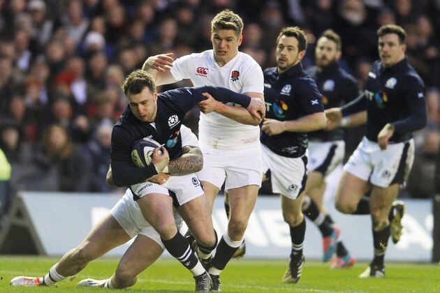England's wing Jack Nowell (L) and England's centre Owen Farrell tackle Scotland's full back Stuart Hogg during the Six Nations rugby match between Scotland and England at Murrayfield Stadium in Edinburgh, Scotland on February 6, 2016.  
 / AFP / NEIL HANNA        (Photo credit should read NEIL HANNA/AFP/Getty Images)