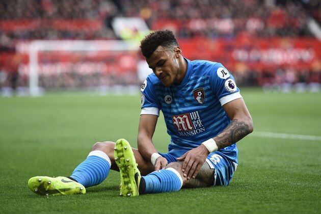 Bournemouth's English defender Tyrone Mings lies injured during the English Premier League football match between Manchester United and Bournemouth at Old Trafford in Manchester, north west England, on March 4, 2017. / AFP PHOTO / Oli SCARFF / RESTRICTED TO EDITORIAL USE. No use with unauthorized audio, video, data, fixture lists, club/league logos or 'live' services. Online in-match use limited to 75 images, no video emulation. No use in betting, games or single club/league/player publications.  /         (Photo credit should read OLI SCARFF/AFP/Getty Images)