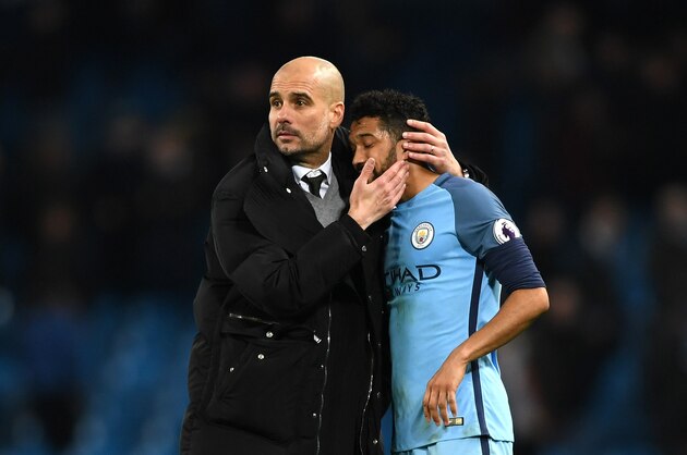 MANCHESTER, ENGLAND - MARCH 08:  Gael Clichy of Manchester City and Josep Guardiola, Manager of Manchester City react after the full time whistle during the Premier League match between Manchester City and Stoke City at Etihad Stadium on March 8, 2017 in Manchester, England.  (Photo by Shaun Botterill/Getty Images)