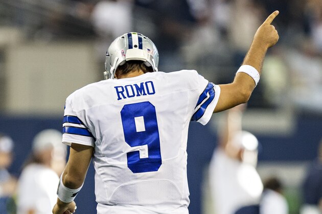 ARLINGTON, TX - OCTOBER 6: Tony Romo #9 of the Dallas Cowboys signals while walking off the field after throwing a touchdown pass against the Denver Broncos at AT&T Stadium on October 6, 2013 in Arlington, Texas. The Broncos defeated the Cowboys 51-48. (Photo by Wesley Hitt/Getty Images)