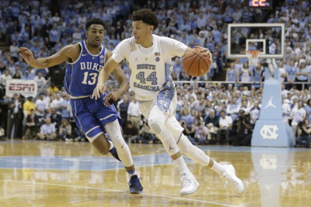 North Carolina's Justin Jackson (44) drives to the basket while Duke's Matt Jones (13) defends during the first half of an NCAA college basketball game in Chapel Hill, N.C., Saturday, March 4, 2017. (AP Photo/Gerry Broome)