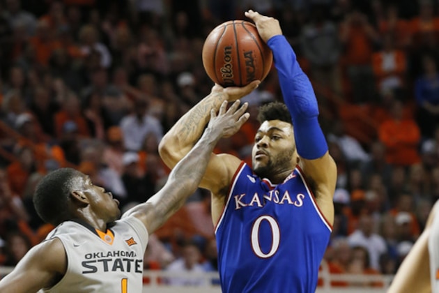 Kansas guard Frank Mason III (0) shoots over Oklahoma State guard Jawun Evans (1) in the second half of an NCAA college basketball game in Stillwater, Okla., Saturday, March 4, 2017. Kansas won 90-85. (AP Photo/Sue Ogrocki)