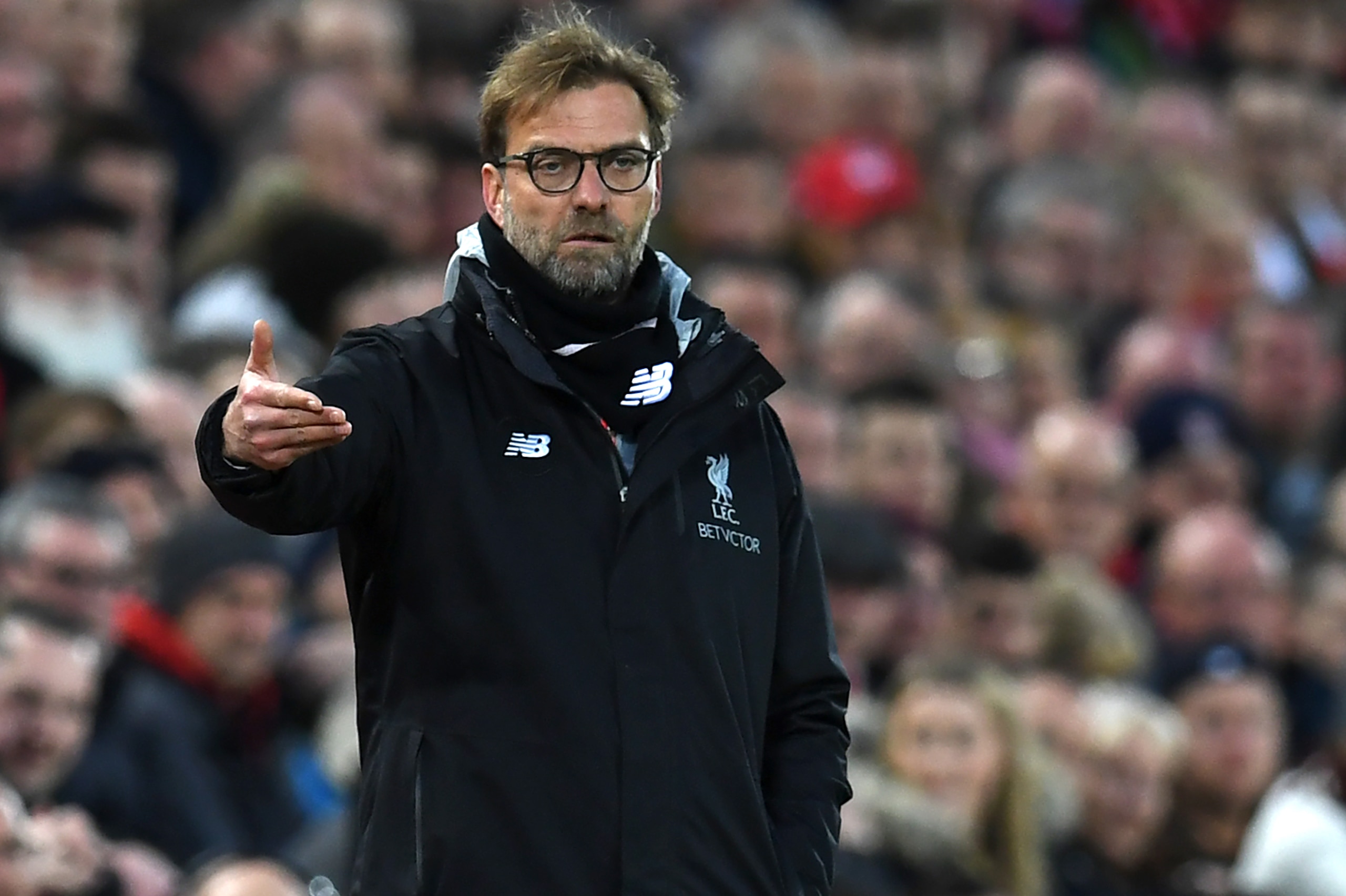 Liverpool's German manager Jurgen Klopp gestures on the touchline during the English Premier League football match between Liverpool and Arsenal at Anfield in Liverpool, north west England on March 4, 2017.  / AFP PHOTO / Paul ELLIS / RESTRICTED TO EDITORIAL USE. No use with unauthorized audio, video, data, fixture lists, club/league logos or 'live' services. Online in-match use limited to 75 images, no video emulation. No use in betting, games or single club/league/player publications.  /         (Photo credit should read PAUL ELLIS/AFP/Getty Images)