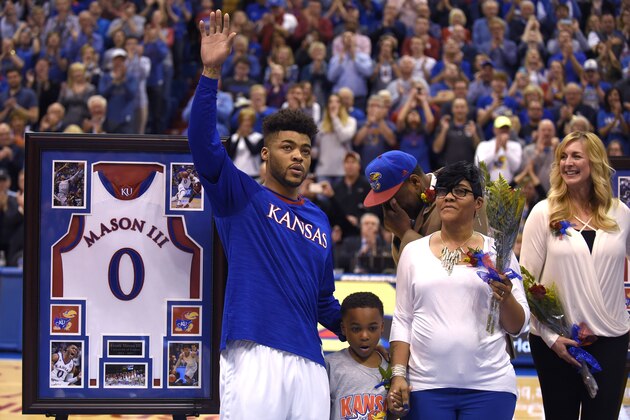 LAWRENCE, KS - FEBRUARY 27: Frank Mason III #0 of the Kansas Jayhawks waves to the crowd as he is recognized during senior night prior to a game against the Oklahoma Sooners at Allen Fieldhouse on February 27, 2017 in Lawrence, Kansas. (Photo by Ed Zurga/Getty Images)