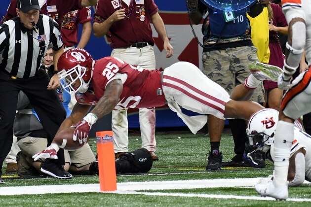 NEW ORLEANS, LA - JANUARY 02: Running back Joe Mixon #25 of the Oklahoma Sooners dives for a touchdown during their victory in the Sugar Bowl against the Auburn Tigers on January 2, 2017 at The Superdome  in New Orleans, Louisiana. (Photo by Jackson Laizure)