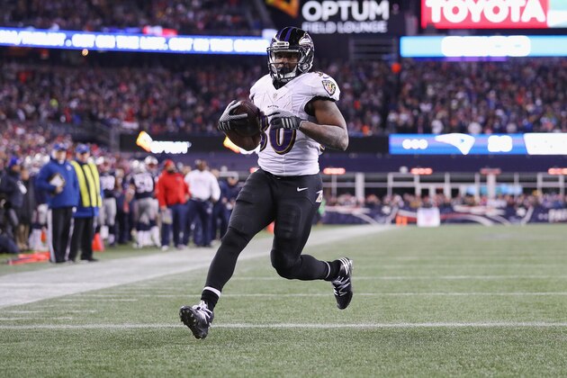 FOXBORO, MA - DECEMBER 12:  Kenneth Dixon #30 of the Baltimore Ravens scores a touchdown during the third quarter against the New England Patriots at Gillette Stadium on December 12, 2016 in Foxboro, Massachusetts.  (Photo by Maddie Meyer/Getty Images)