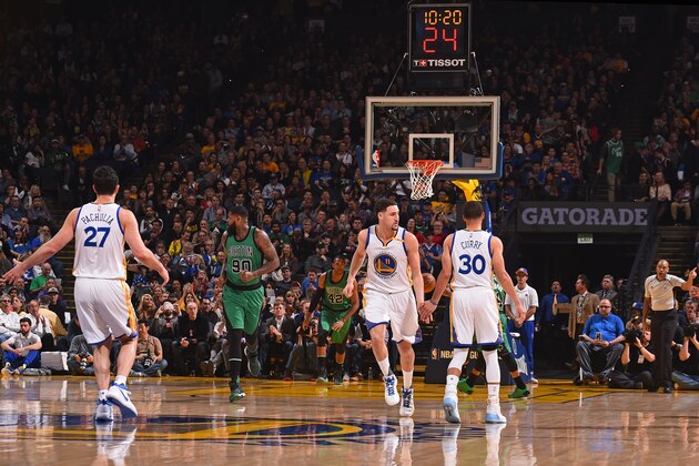 OAKLAND, CA - MARCH 8:  Stephen Curry #30 and Klay Thompson #11 of the Golden State Warriors high five during the game against the Boston Celtics on March 8, 2017 at ORACLE Arena in Oakland, California. NOTE TO USER: User expressly acknowledges and agrees that, by downloading and or using this photograph, user is consenting to the terms and conditions of Getty Images License Agreement. Mandatory Copyright Notice: Copyright 2017 NBAE (Photo by Noah Graham/NBAE via Getty Images)