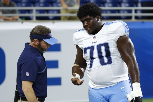 FILE - In this Sunday, Sept. 18, 2016, file photo, Tennessee Titans guard Chance Warmack (70) has his hand checked by a trainer before an NFL football game against the Detroit Lions in Detroit. Warmack will have surgery to repair a torn tendon in a finger on his right hand, and the Titans plan to place him on injured reserve, coach Mike Mularkey said Wednesday, Sept. 21, 2016.  (AP Photo/Paul Sancya, File)