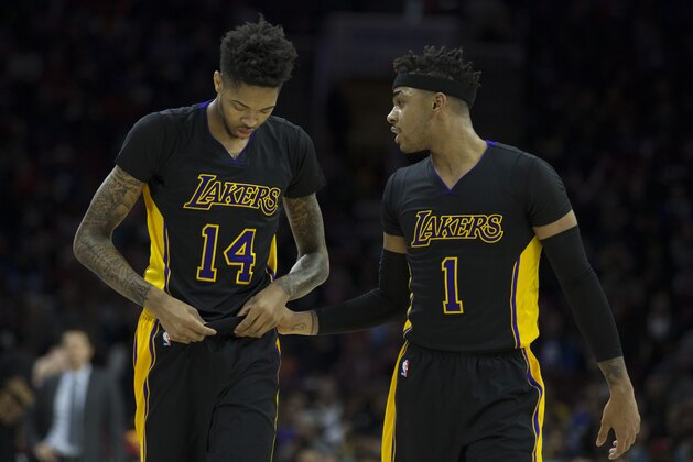 PHILADELPHIA, PA - DECEMBER 16: Brandon Ingram #14 and D'Angelo Russell #1 of the Los Angeles Lakers talk to each other after a timeout in the first quarter against the Philadelphia 76ers at Wells Fargo Center on December 16, 2016 in Philadelphia, Pennsylvania. The Lakers defeated the 76ers 100-89. NOTE TO USER: User expressly acknowledges and agrees that, by downloading and or using this photograph, User is consenting to the terms and conditions of the Getty Images License Agreement. (Photo by Mitchell Leff/Getty Images)