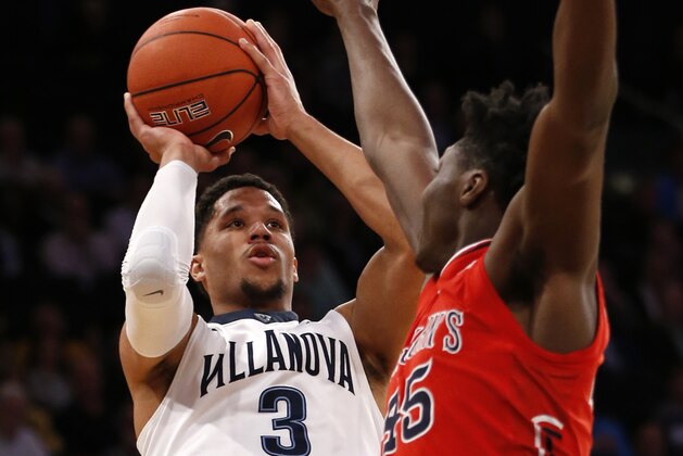 Villanova guard Josh Hart (3) goes up for two points as St. John's forward Darien Williams (45) defends during the first half an NCAA college basketball game in the quarterfinals of the Big East conference tournament at Madison Square Garden, Thursday, March 9, 2017, in New York. (AP Photo/Kathy Willens)
