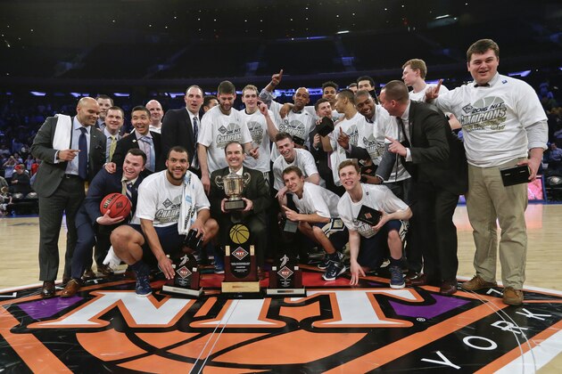 George Washington players celebrate after winning the NIT on Thursday, March 31, 2016, in New York. George Washington defeated Valparaiso 76-60 in the final. (AP Photo/Frank Franklin II)