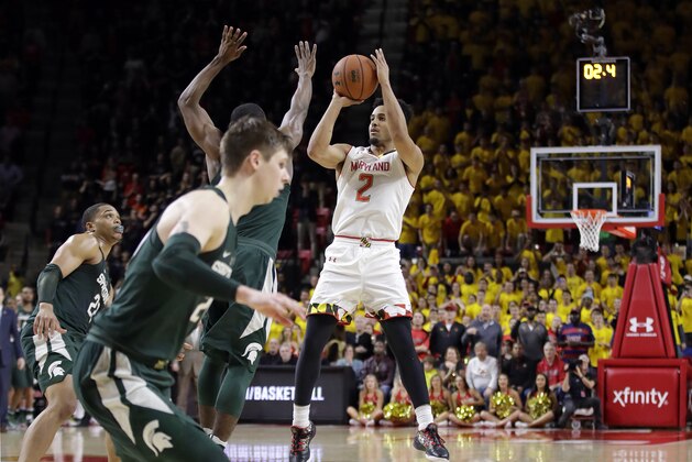 Maryland guard Melo Trimble (2) shoots the game-winning shot in the final moments of an NCAA college basketball game against Michigan State, Saturday, March 4, 2017, in College Park, Md. Maryland won 63-60. (AP Photo/Patrick Semansky)