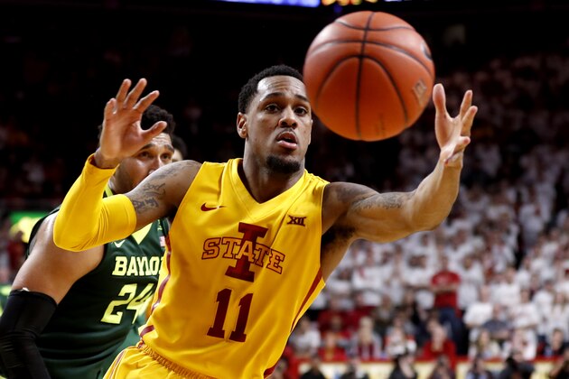 AMES, IA - FEBRUARY 25: Monte Morris #11 of the Iowa State Cyclones pulls in a pass as Ishmail Wainright #24 of the Baylor Bears puts pressure on in the second half of play at Hilton Coliseum on February 25, 2017 in Ames, Iowa. The Iowa State Cyclones won 72-69 over the Baylor Bears. (Photo by David K Purdy/Getty Images)