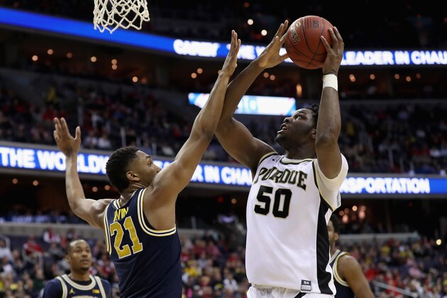 WASHINGTON, DC - MARCH 10: Caleb Swanigan #50 of the Purdue Boilermakers shoots over Zak Irvin #21 of the Michigan Wolverines during the Big Ten Basketball Tournament at Verizon Center on March 10, 2017 in Washington, DC.  (Photo by Rob Carr/Getty Images)