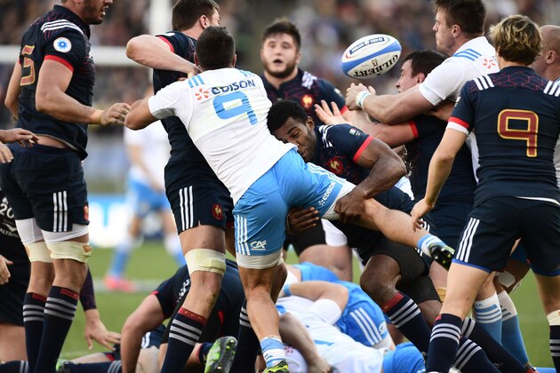Italy's scrum-half Edoardo Gori (C) is tackled by France's France's wing Noa Seru Nakaitaci during the International Six Nations rugby union match Italy vs France on March 11, 2017 at the Olympic Stadium in Rome.  / AFP PHOTO / MIGUEL MEDINA        (Photo credit should read MIGUEL MEDINA/AFP/Getty Images)