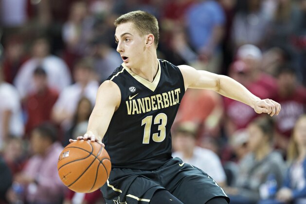 FAYETTEVILLE, AR - FEBRUARY 7:  Riley LaChance #13 of the Vanderbilt Commodores changes his dribble direction during a game against the Arkansas Razorbacks at Bud Walton Arena on February 7, 2017 in Fayetteville, Arkansas.  The Commodores defeated the Razorbacks 72-59.  (Photo by Wesley Hitt/Getty Images)