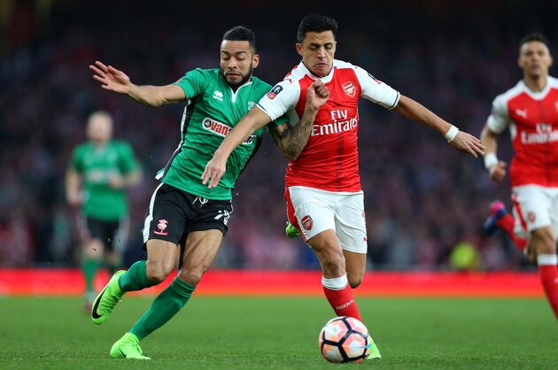 LONDON, ENGLAND - MARCH 11:  Nathan Arnold of Lincoln City and Alexis Sanchez of Arsenal compete during The Emirates FA Cup Quarter-Final match between Arsenal and Lincoln City at Emirates Stadium on March 11, 2017 in London, England. (Photo by Catherine Ivill - AMA/Getty Images)