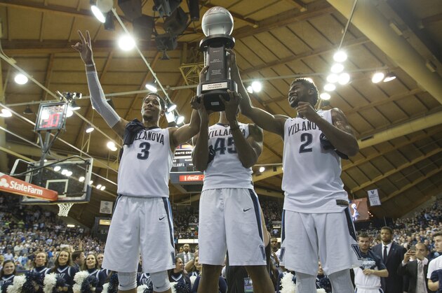 PHILADELPHIA, PA - FEBRUARY 25: Josh Hart #3, Darryl Reynolds #45, and Kris Jenkins #2 of the Villanova Wildcats celebrate with the regular season Big East Conference trophy at the end of the game against the Creighton Bluejays at the Pavilion on February 25, 2017 in Villanova, Pennsylvania. The Wildcats defeated the Bluejays 79-63. (Photo by Mitchell Leff/Getty Images)