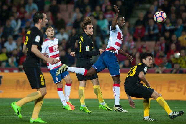 Granada's Colombian forward Adrian Ramos (2ndR) vies with French forward Antoine Griezmann (C) and Argentinian midfielder Nicolas Gaitan (R) during the Spanish league football match Granada CF vs Club Atletico de Madrid at Nuevo Los Carmenes stadium in Granada on March 11, 2017. / AFP PHOTO / JORGE GUERRERO        (Photo credit should read JORGE GUERRERO/AFP/Getty Images)