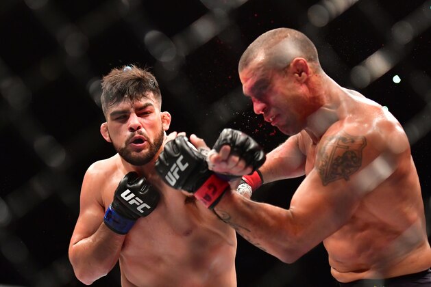 Mar 11, 2017; Fortazela, Brazil, USA;  Kelvin Gastelum (blue gloves) fights Vitor Belfort (red gloves) during UFC Fight Night at Centro de Formacao Olimpica de Fortaleza. Mandatory Credit: Jason Silva-USA TODAY Sports