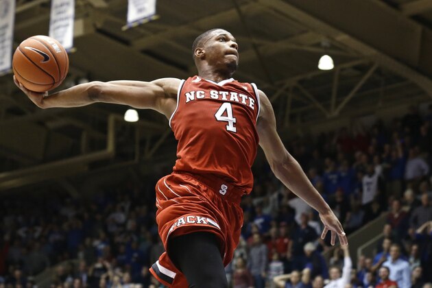 FILE - In this Jan. 23, 2017 file photo, North Carolina State's Dennis Smith Jr. (4) drives to the basket as time expires in the second half of an NCAA college basketball game against Duke in Durham, N.C. Smith has two triple-doubles this season, but N.C. State sits near the bottom of the Atlantic Coast Conference entering Wednesday’s game against rival North Carolina. (AP Photo/Gerry Broome, File)