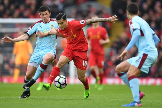 Burnley's English midfielder Joey Barton (L) vies with Liverpool's Brazilian midfielder Philippe Coutinho during the English Premier League football match between Liverpool and Burnley at Anfield in Liverpool, north west England on March 12, 2017. / AFP PHOTO / Paul ELLIS / RESTRICTED TO EDITORIAL USE. No use with unauthorized audio, video, data, fixture lists, club/league logos or 'live' services. Online in-match use limited to 75 images, no video emulation. No use in betting, games or single club/league/player publications.  /         (Photo credit should read PAUL ELLIS/AFP/Getty Images)