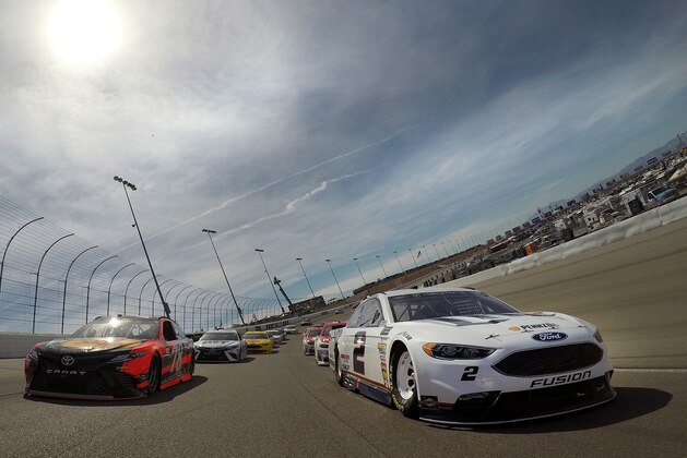 LAS VEGAS, NV - MARCH 12:  Brad Keselowski, driver of the #2 Miller Lite Ford, and Martin Truex Jr., driver of the #78 Bass Pro Shops/TRACKER BOATS Toyota, lead the field under caution prior to the start of the Monster Energy NASCAR Cup Series Kobalt 400 at Las Vegas Motor Speedway on March 12, 2017 in Las Vegas, Nevada.  (Photo by Chris Graythen/Getty Images)