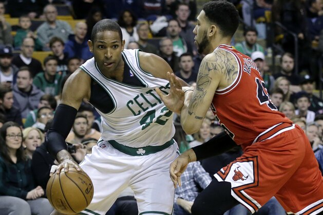 Boston Celtics center Al Horford, left, looks for an opening past Chicago Bulls guard Denzel Valentine, right, in the first quarter of an NBA basketball game, Sunday, March 12, 2017, in Boston. (AP Photo/Steven Senne)0