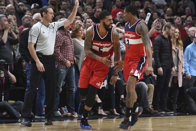 Washington Wizards forward Markieff Morris (5) and guard Bradley Beal celebrate after Morris hit a shot during overtime of the team's NBA basketball game against the Portland Trail Blazers in Portland, Ore., Saturday, March 11, 2017. The Wizards won 125-124. (AP Photo/Steve Dykes)