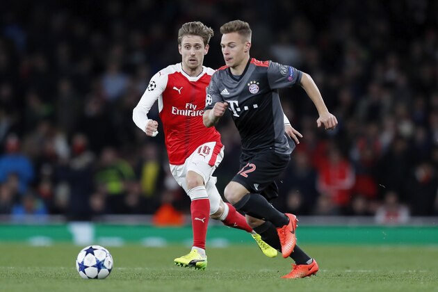 LONDON, ENGLAND - MARCH 07:  Nacho Monreal of Arsenal challenges Joshua Kimmich of FC Bayern Muenchen during the UEFA Champions League Round of 16 second leg match between Arsenal FC and FC Bayern Muenchen at Emirates Stadium on March 7, 2017 in London, United Kingdom.  (Photo by Boris Streubel/Getty Images)