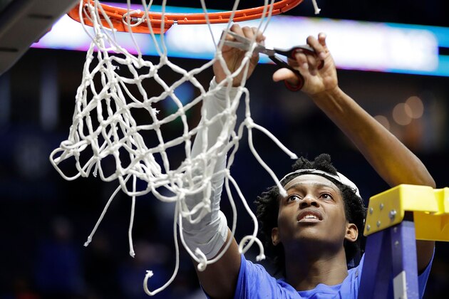 NASHVILLE, TN - MARCH 12:  De'Aaron Fox #0 of the Kentucky Wildcats cuts the net after their 82-65 win over the Arkansas Razorbacks in the championship game at the 2017 Men's SEC Basketball Tournament at Bridgestone Arena on March 12, 2017 in Nashville, Tennessee.  (Photo by Andy Lyons/Getty Images)